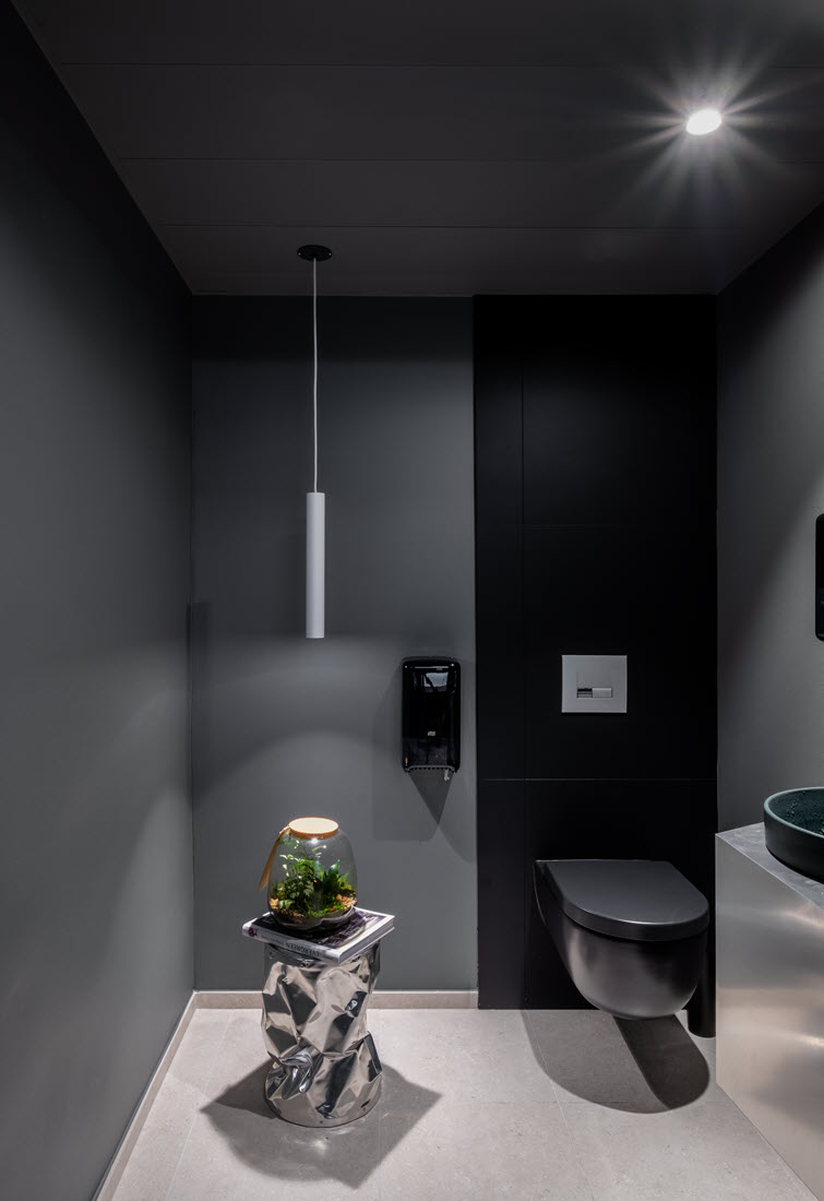 Contrasting grey-black combination with MDF panels in the toilet.
